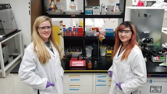 Laurie Barge and Erika Flores working in the Lab